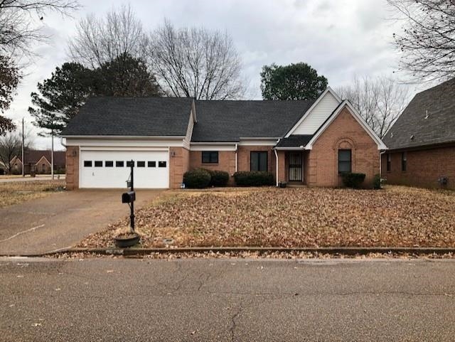 Single story home featuring a garage