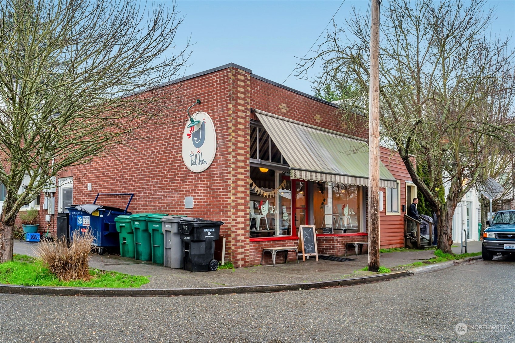 a view of a house with a patio and a yard