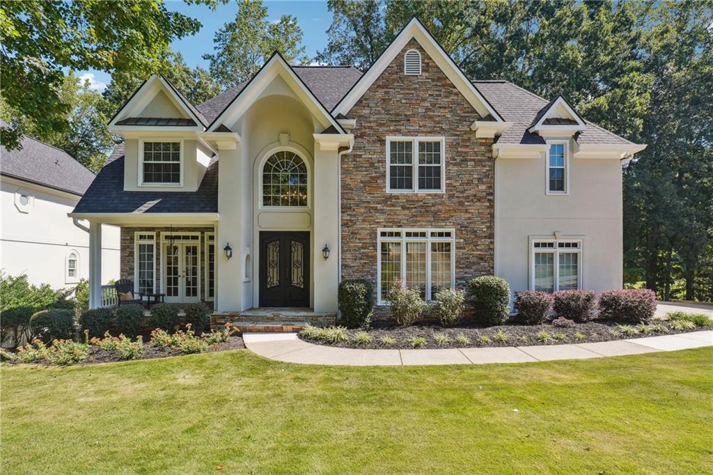 a front view of a house with a yard