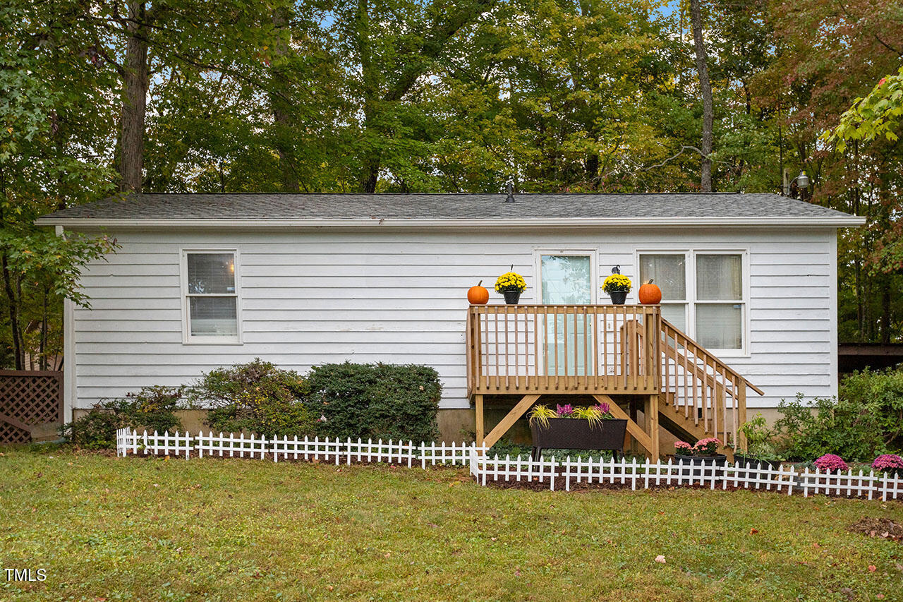 a view of a garden with a small deck