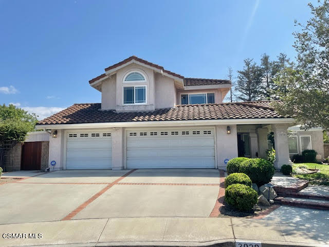 a front view of a house with a garage