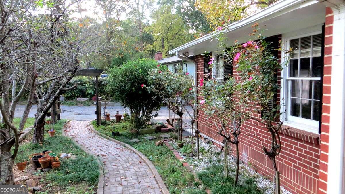 a picture of flowers in front of house