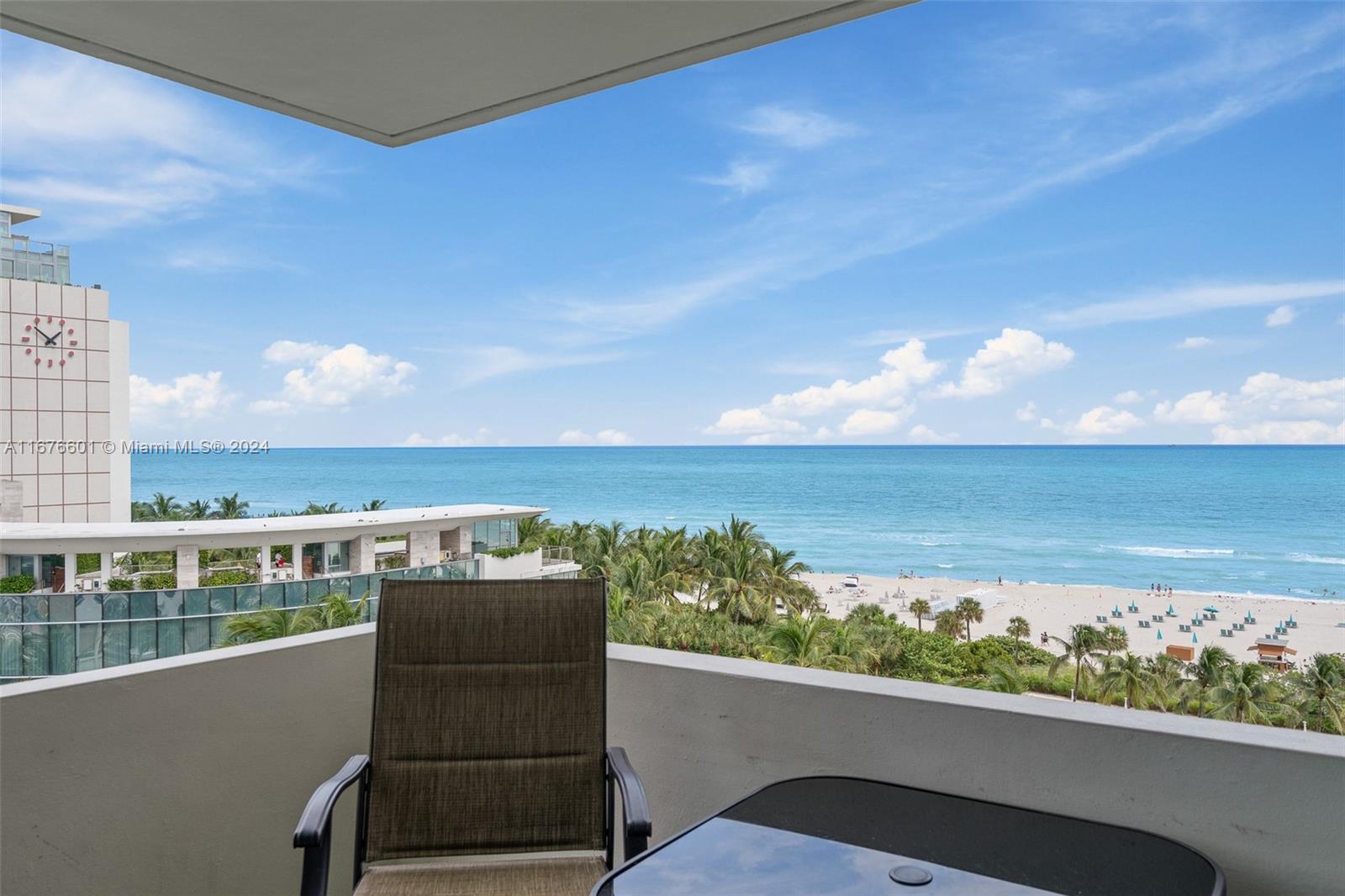 a view of a balcony with an ocean view