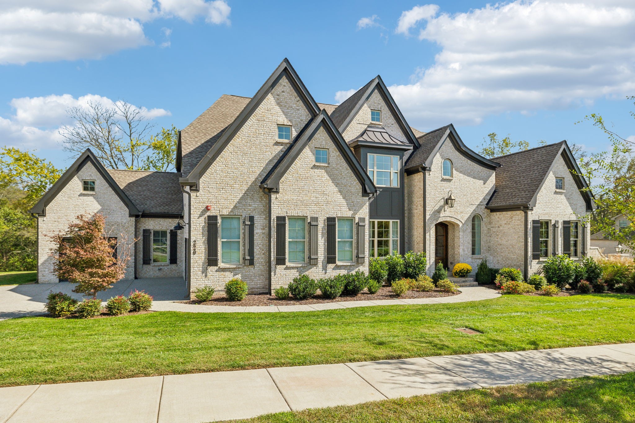 a front view of house with yard and green space