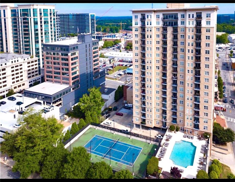 a view of swimming pool with outdoor seating