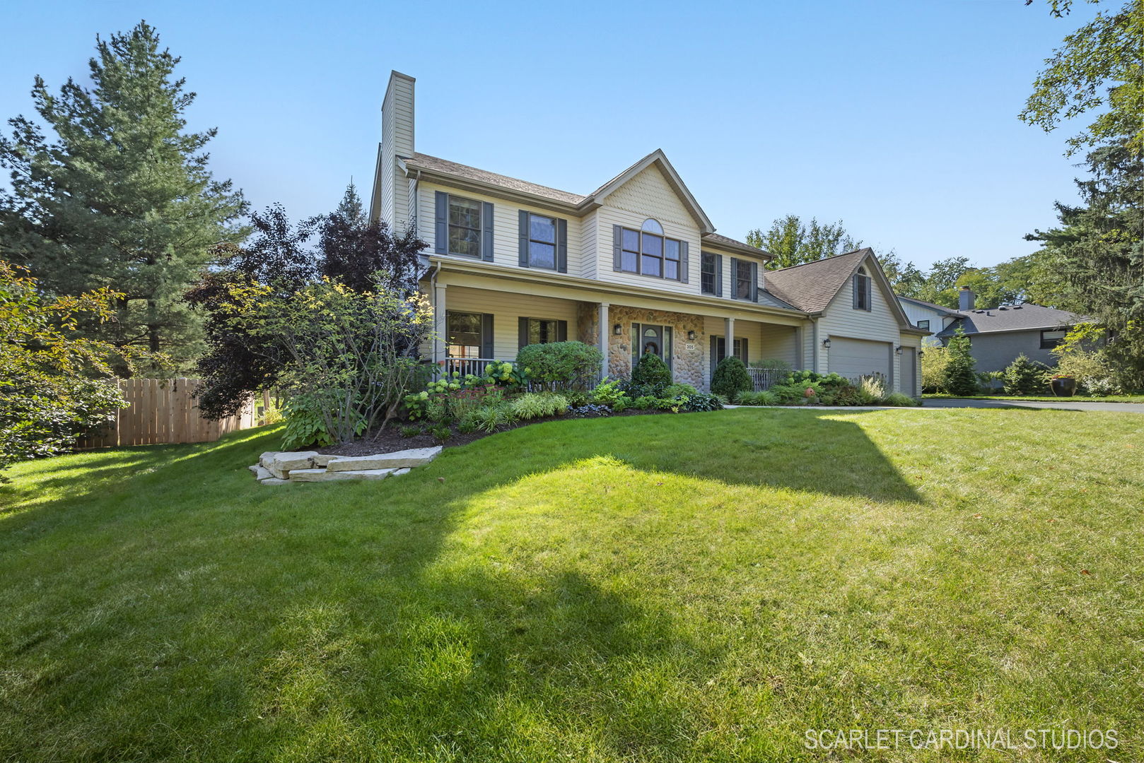 a view of house that has a yard