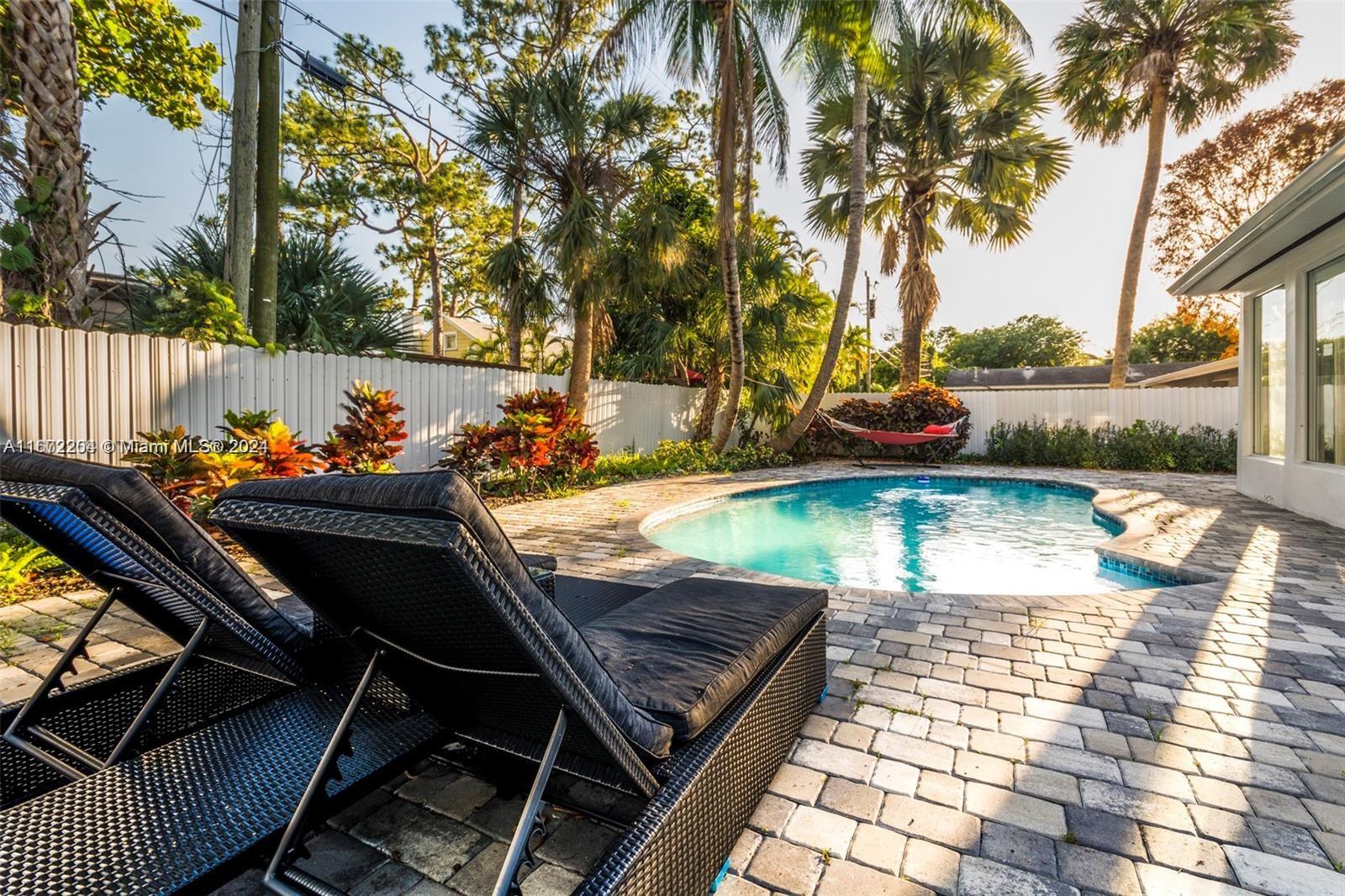 a view of a swimming pool with a patio