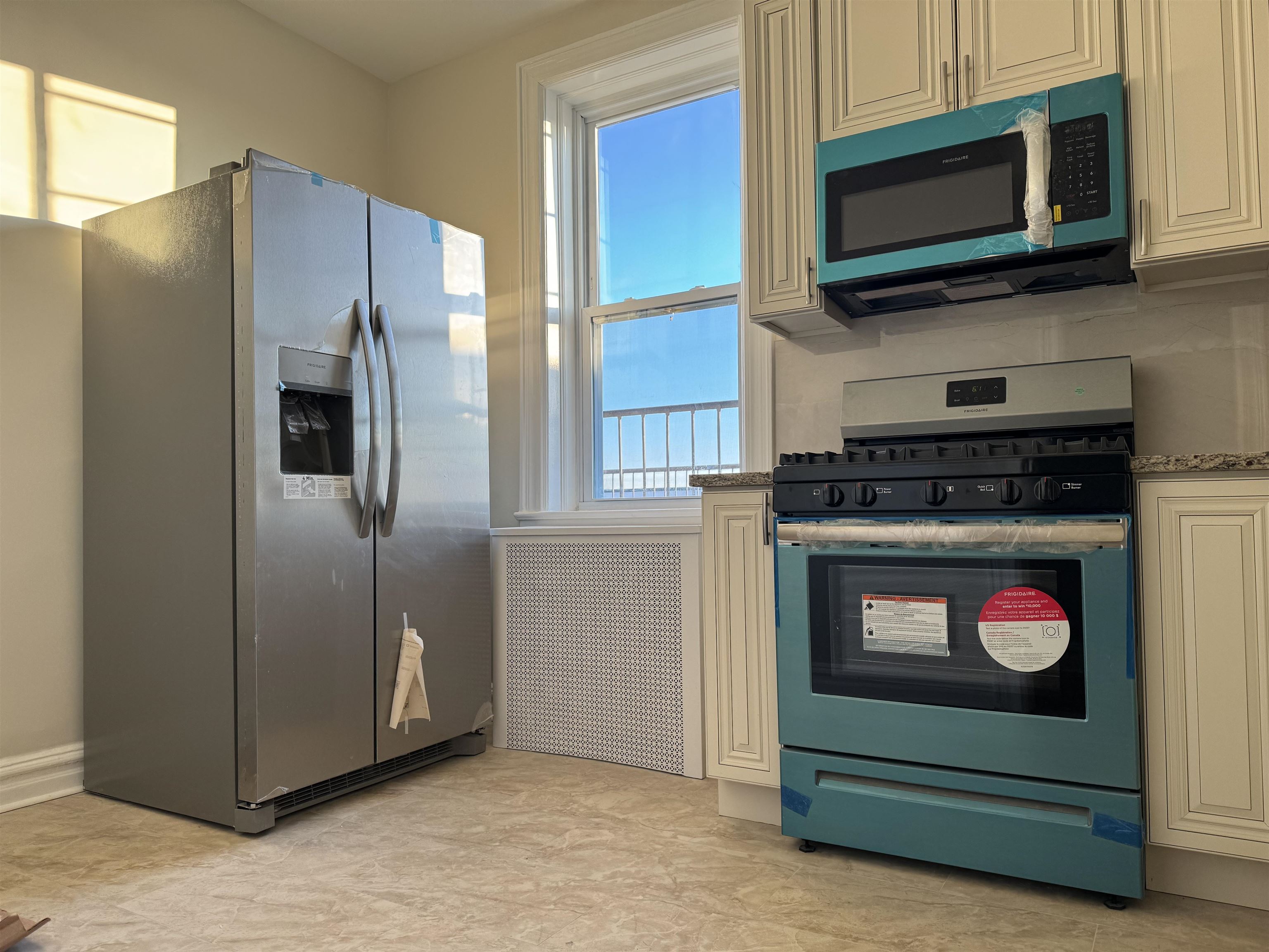 a kitchen with granite countertop cabinets and steel stainless steel appliances