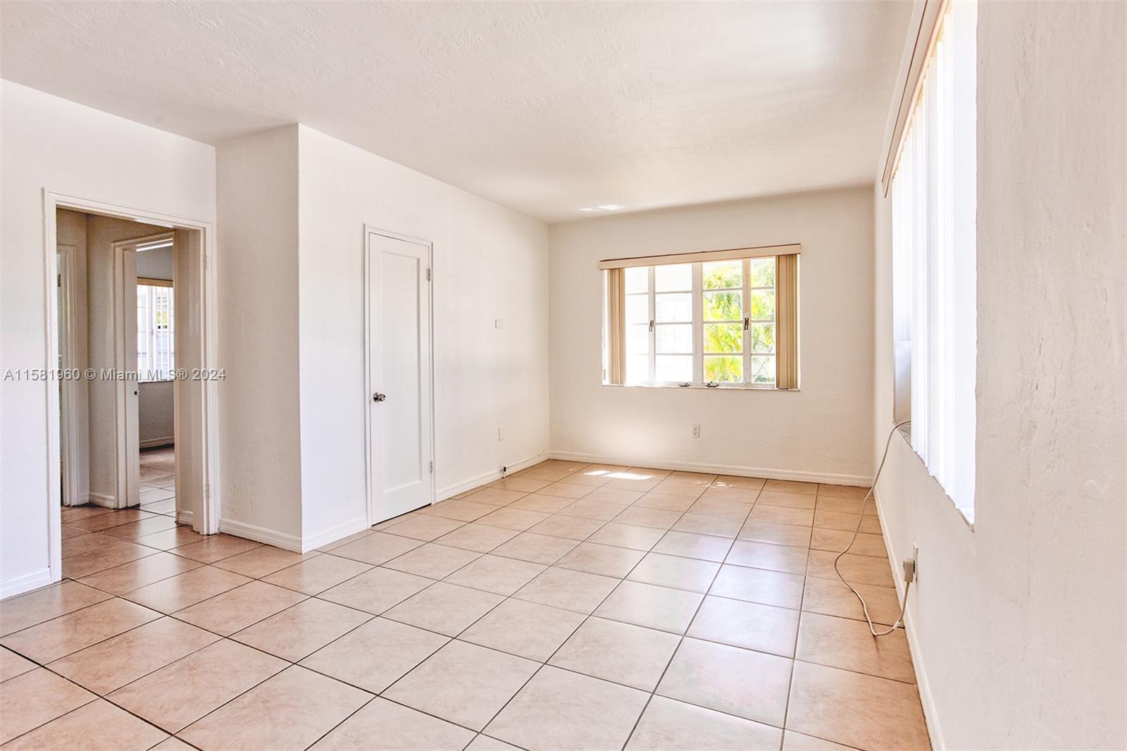 a view of an empty room and window