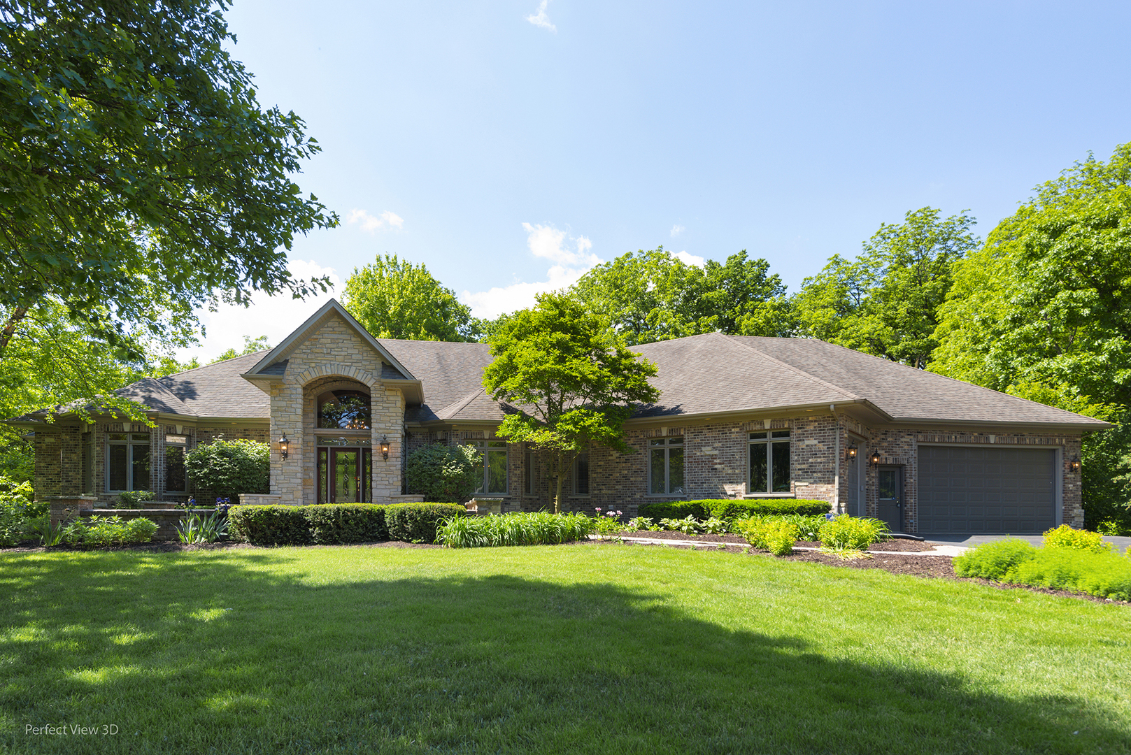 a front view of house with yard and green space