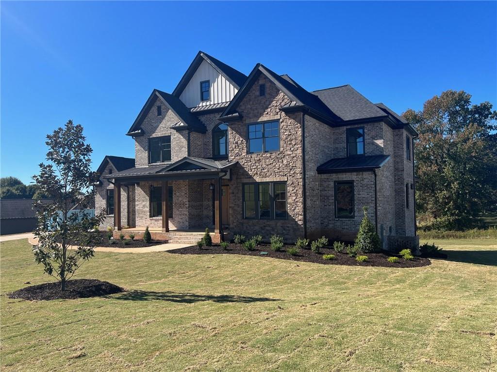 a front view of a house with a yard