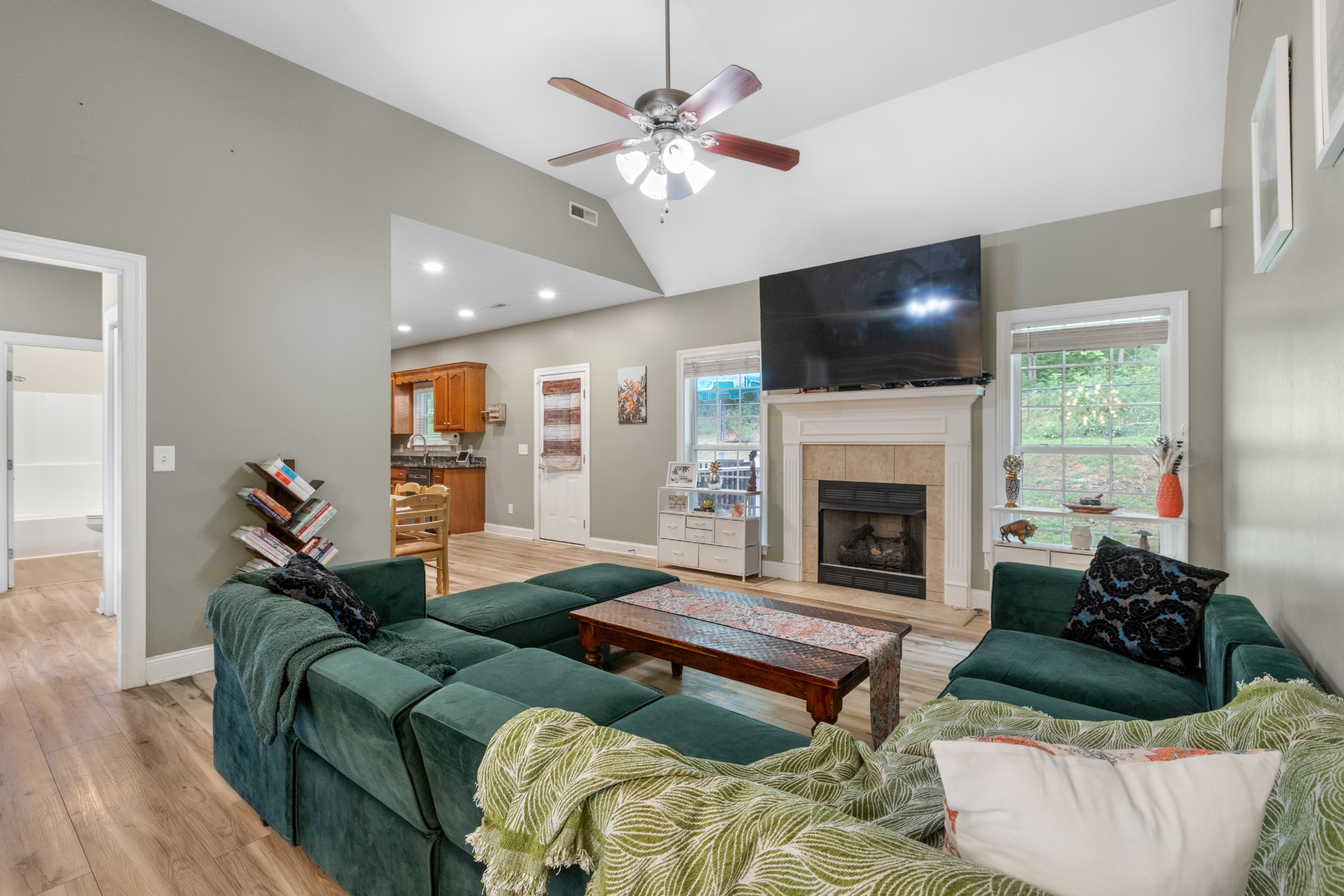 a living room with furniture and a fireplace