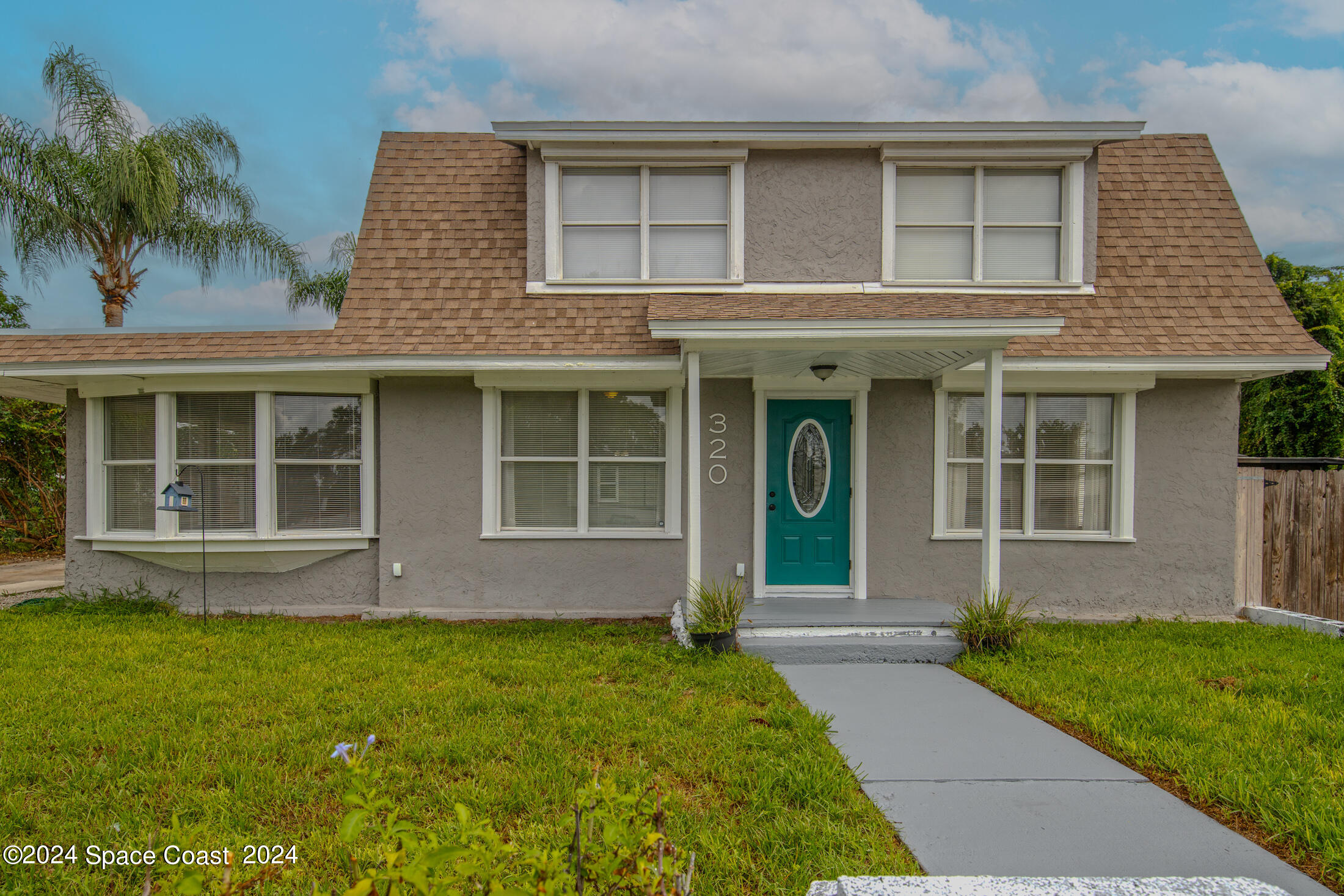 a front view of a house having yard