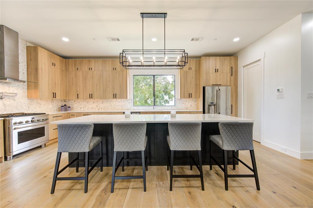 This oversized island is the focal point in this custom built kitchen.  Lots of storage on both sides too!