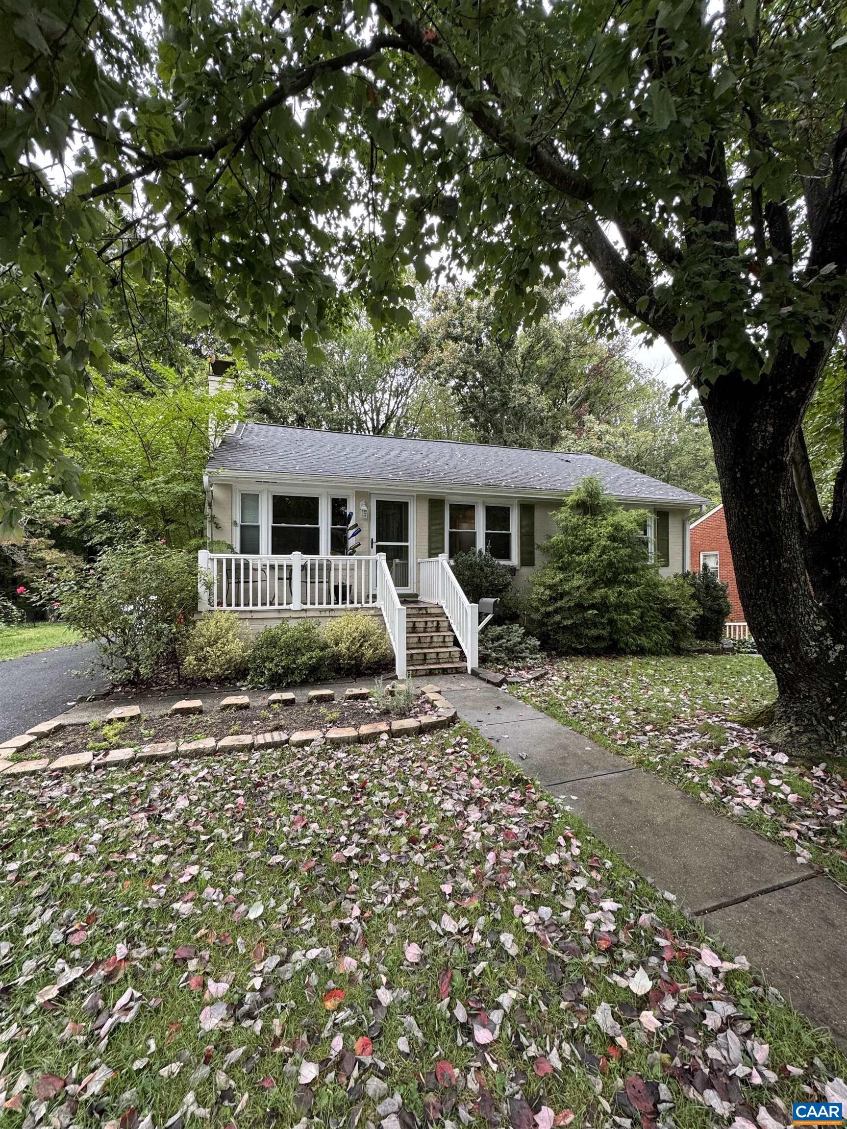 a house with trees in the background