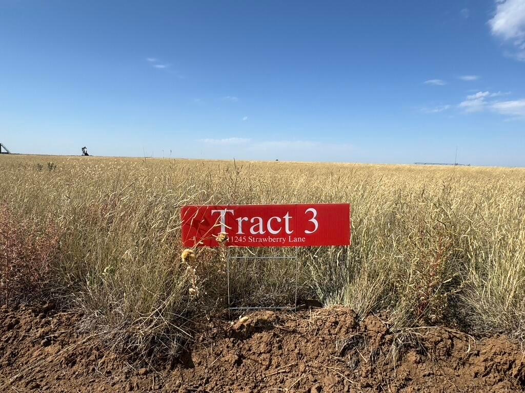 a sign broad in the middle of a field