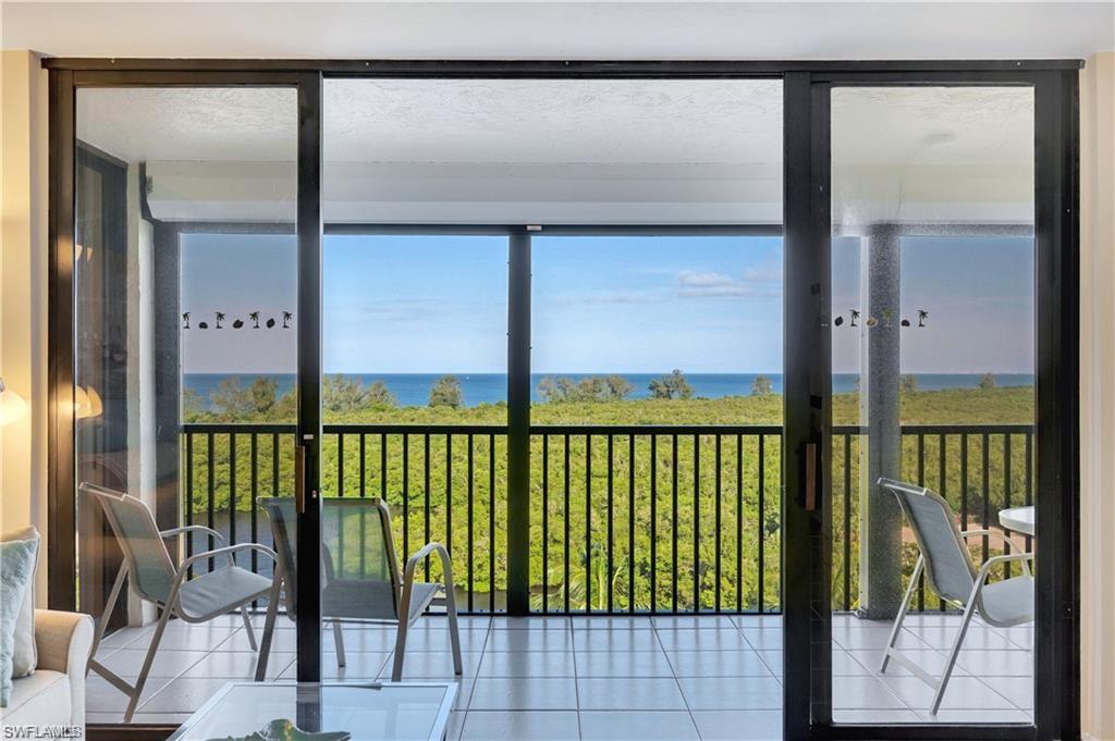 Sunroom / solarium with a water view