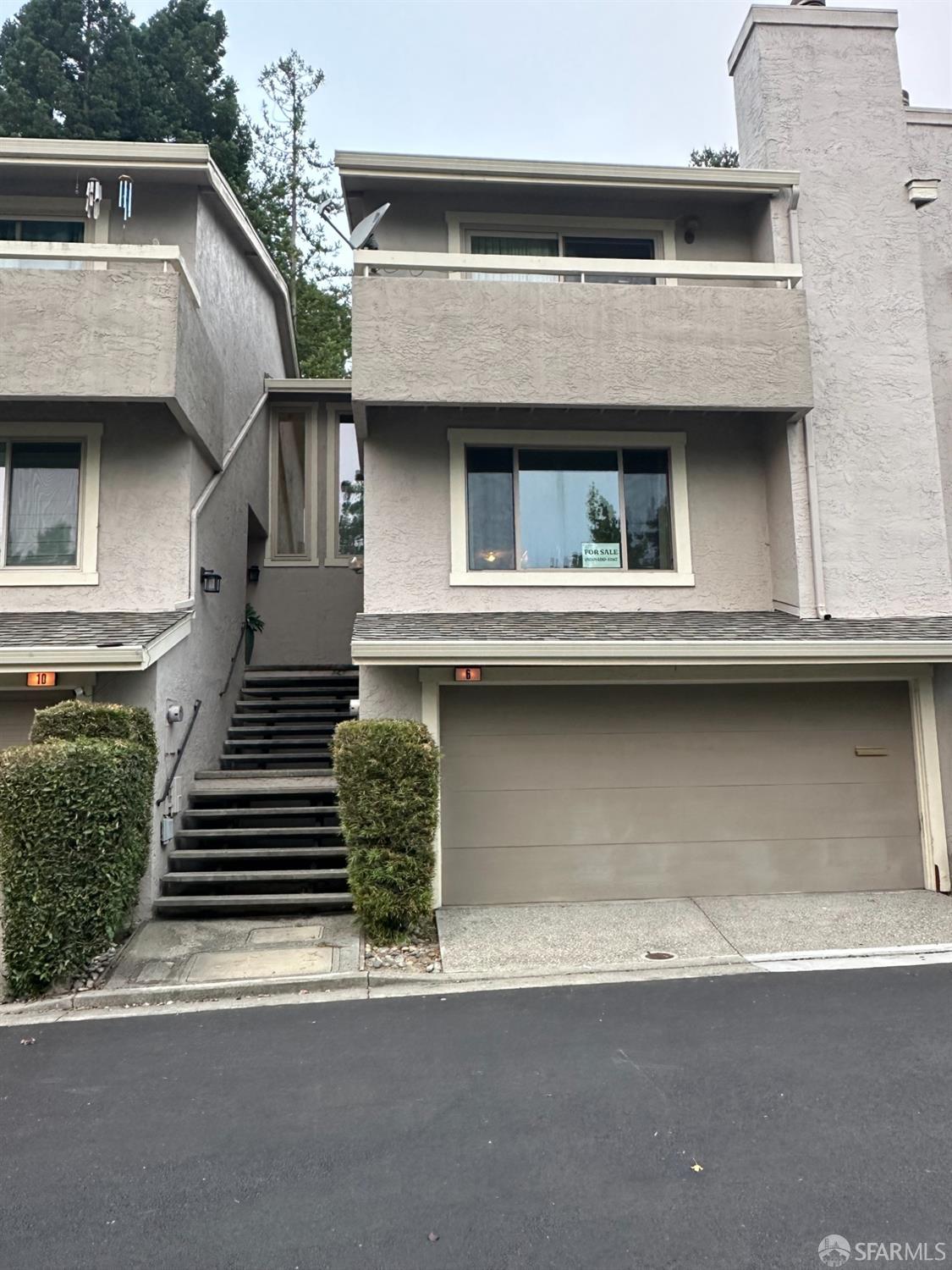 a front view of a house with a garage