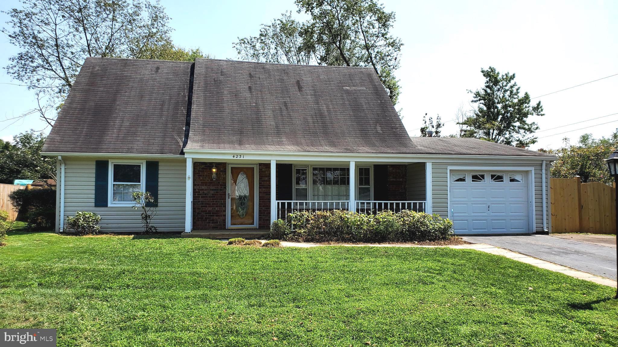 a view of a house with garden and yard