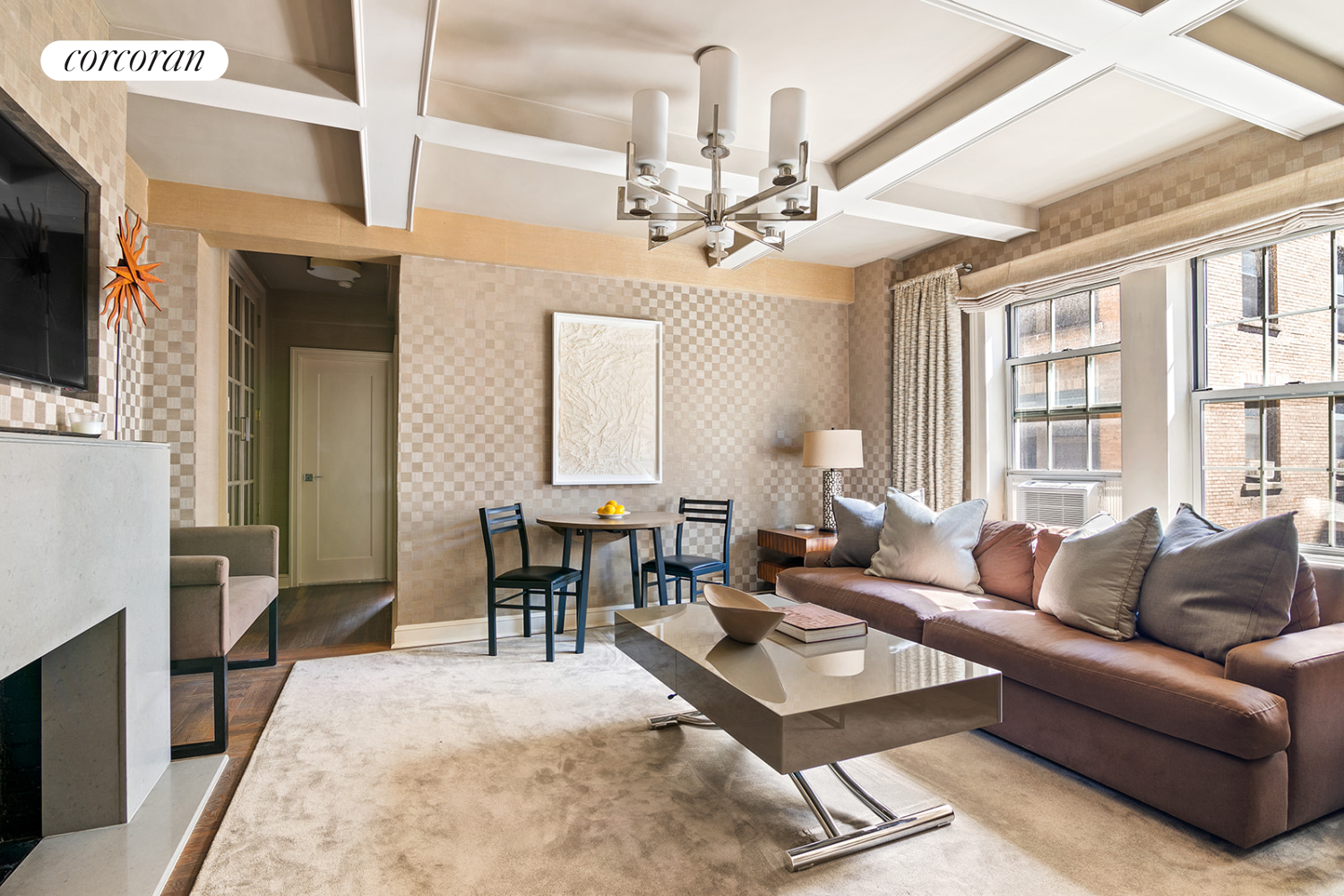 a living room with furniture a dining table and a fireplace