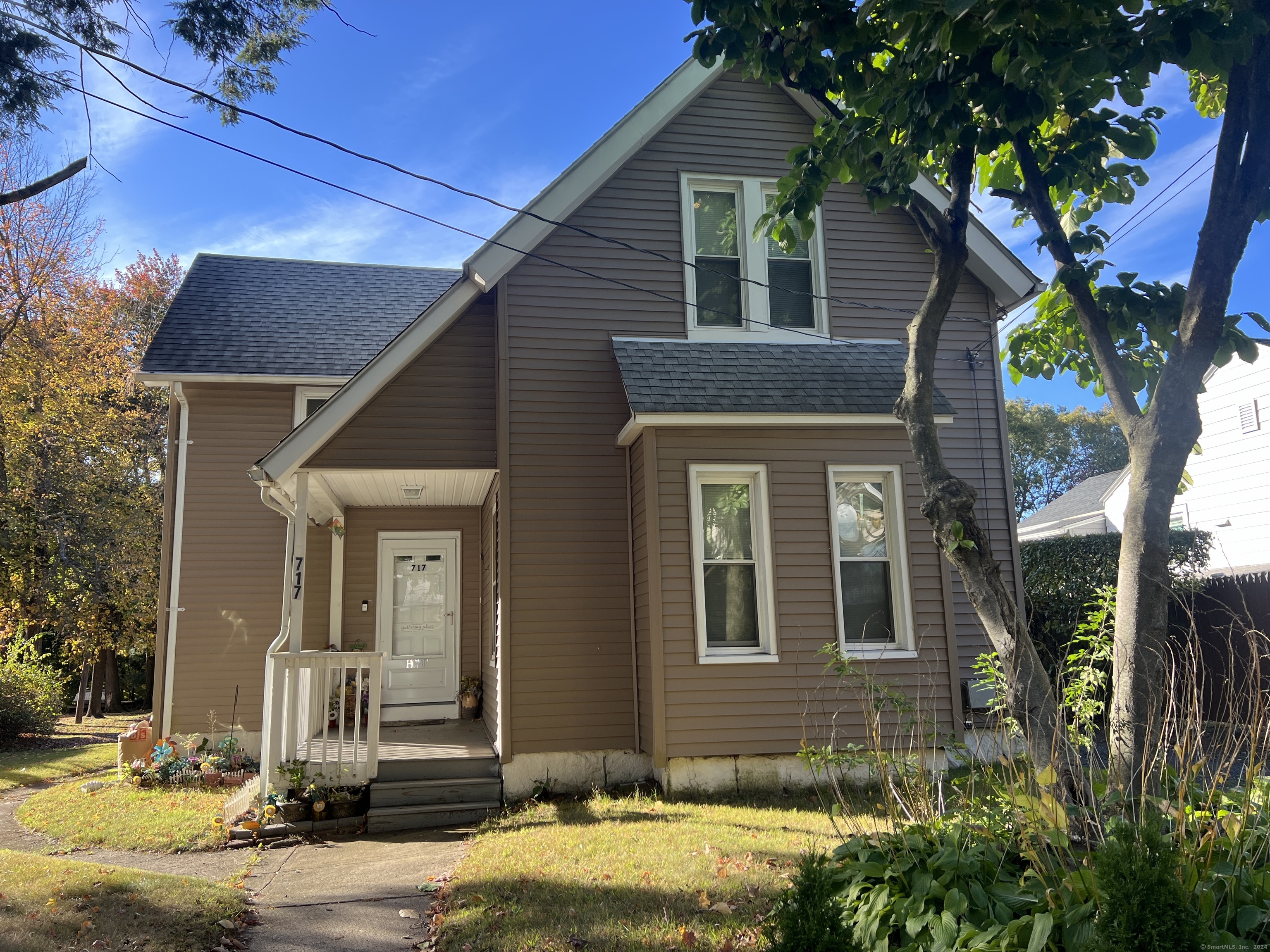 a front view of a house with garden