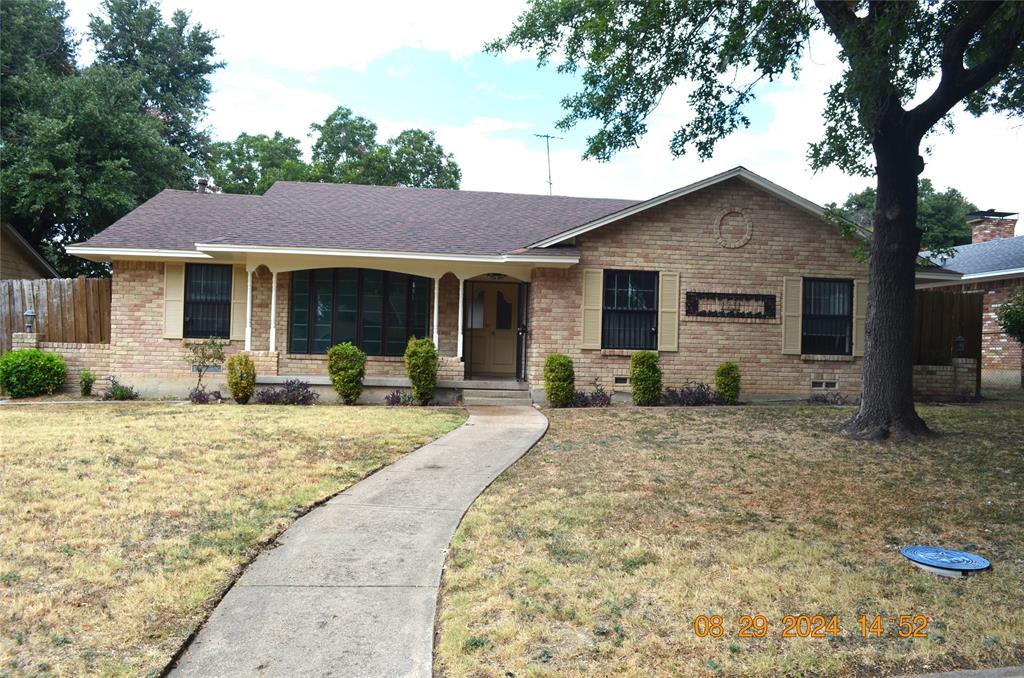 a front view of house with yard outdoor seating and barbeque oven