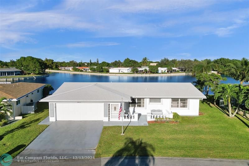 an aerial view of a house with a big yard