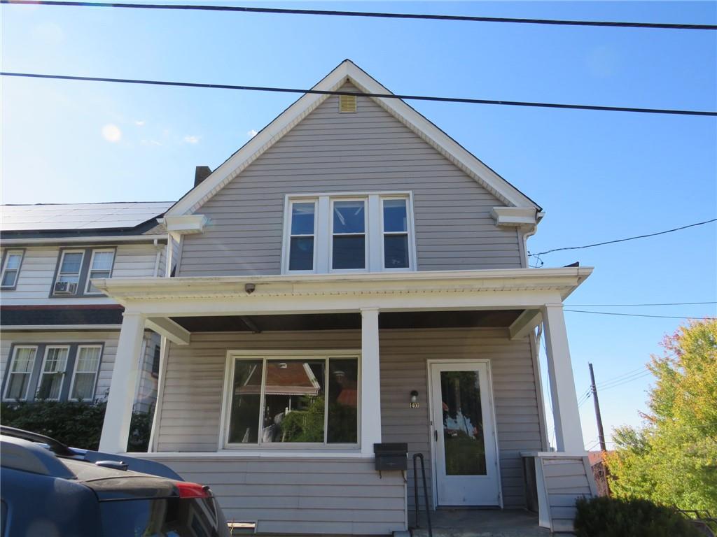 a view of a house with large windows