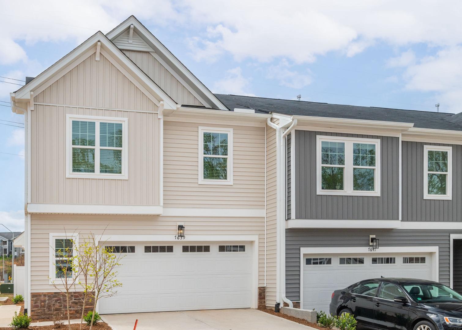 a front view of a house with a garage