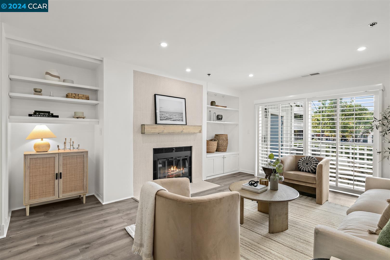 a living room with furniture and a fireplace