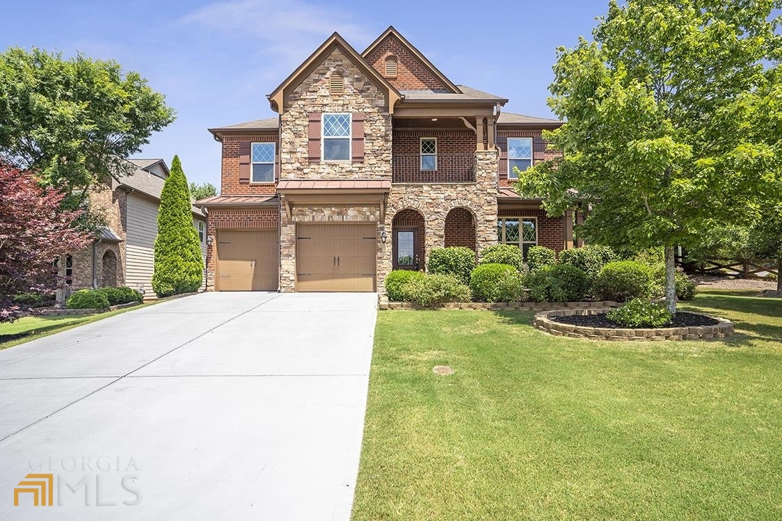 a front view of a house with a yard