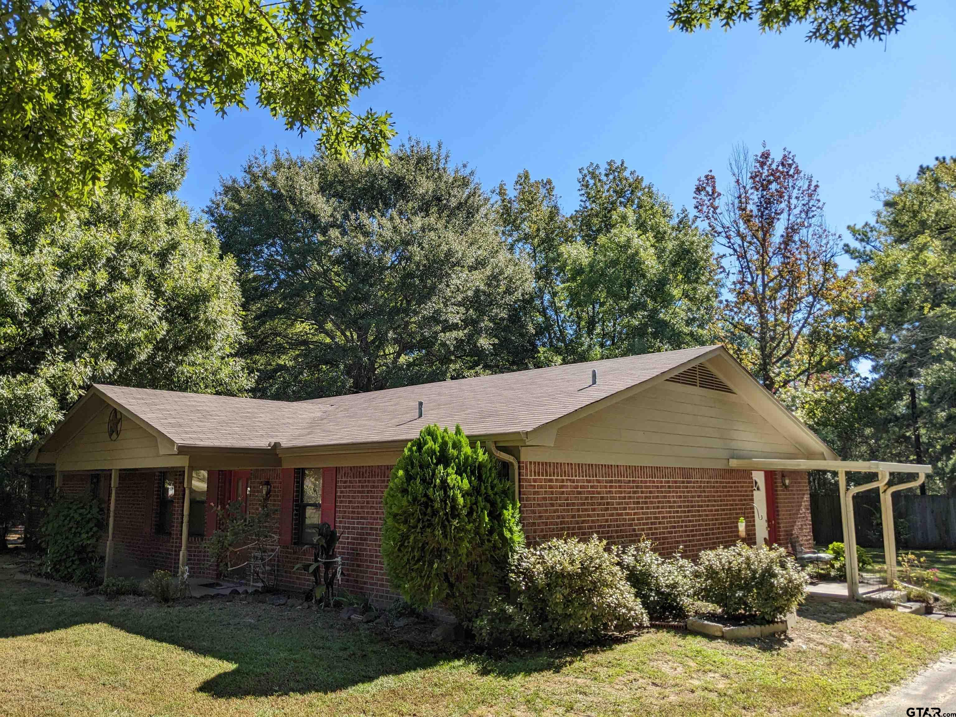 front view of a house with a yard