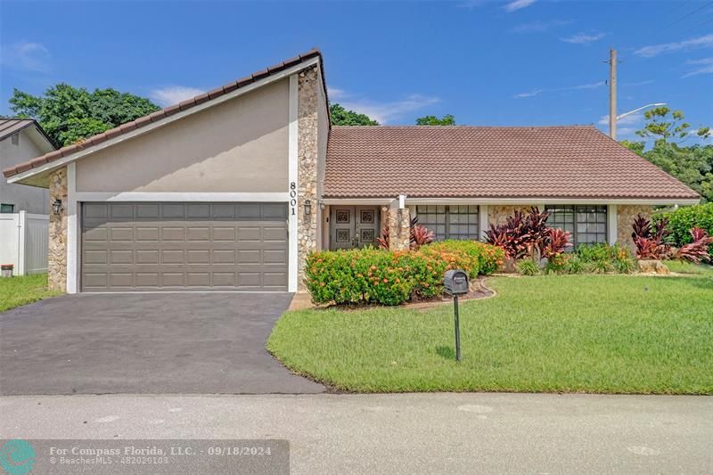 a view of a house with a backyard