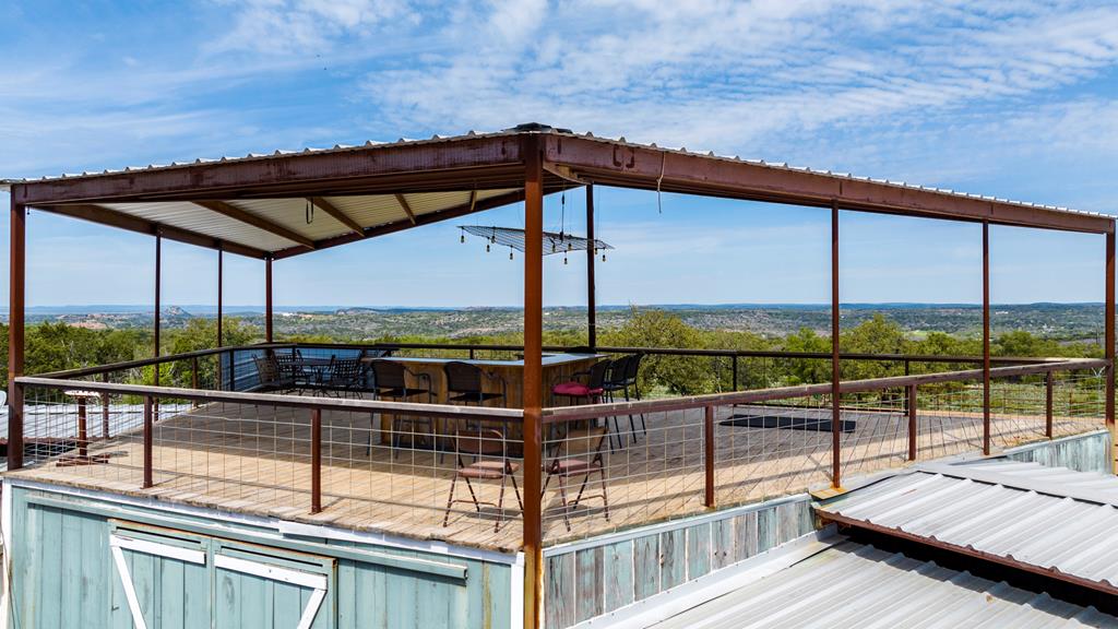 a view of a balcony with chairs