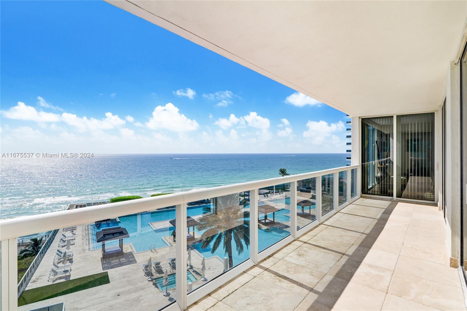 a view of balcony with furniture