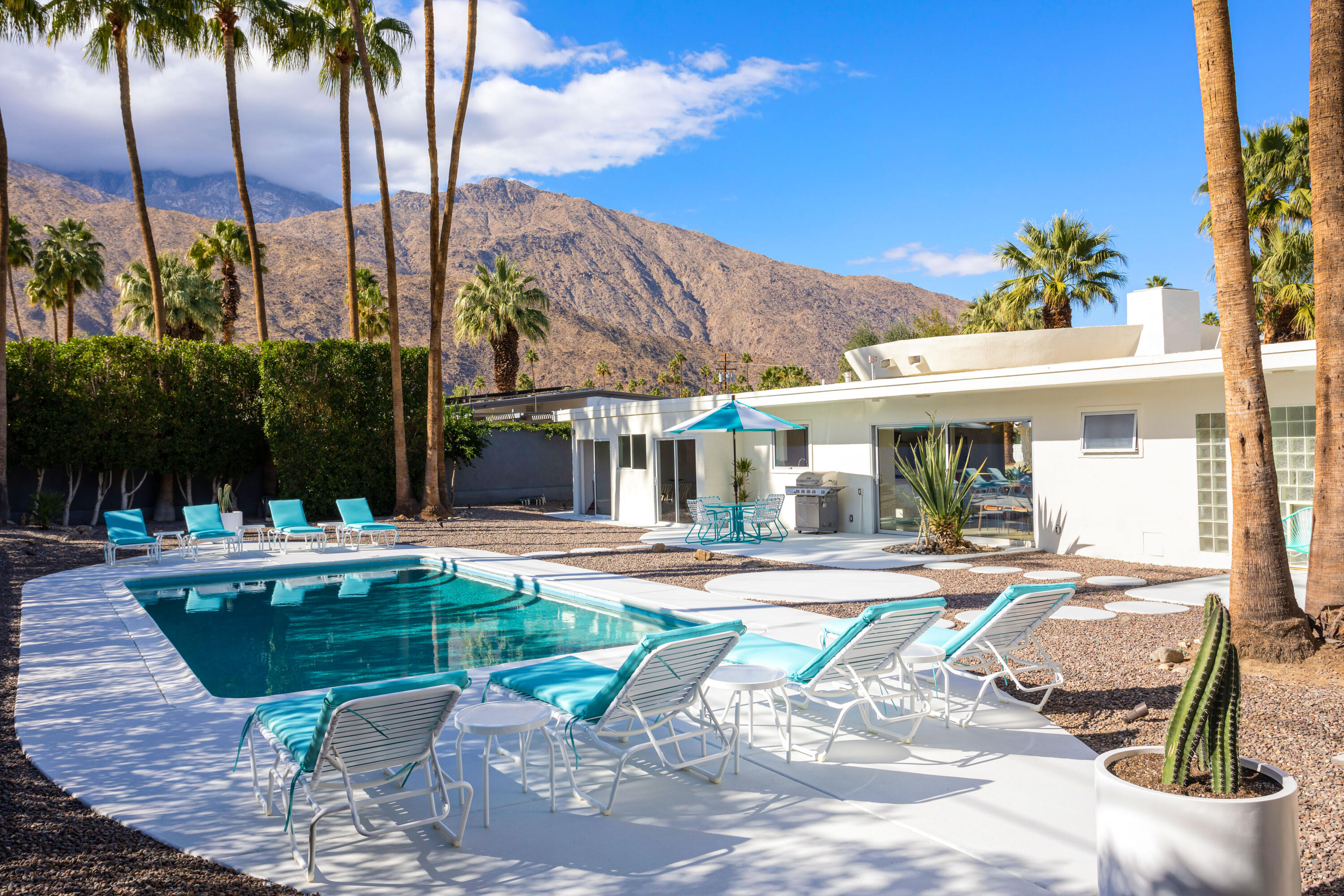 a view of a swimming pool with a patio