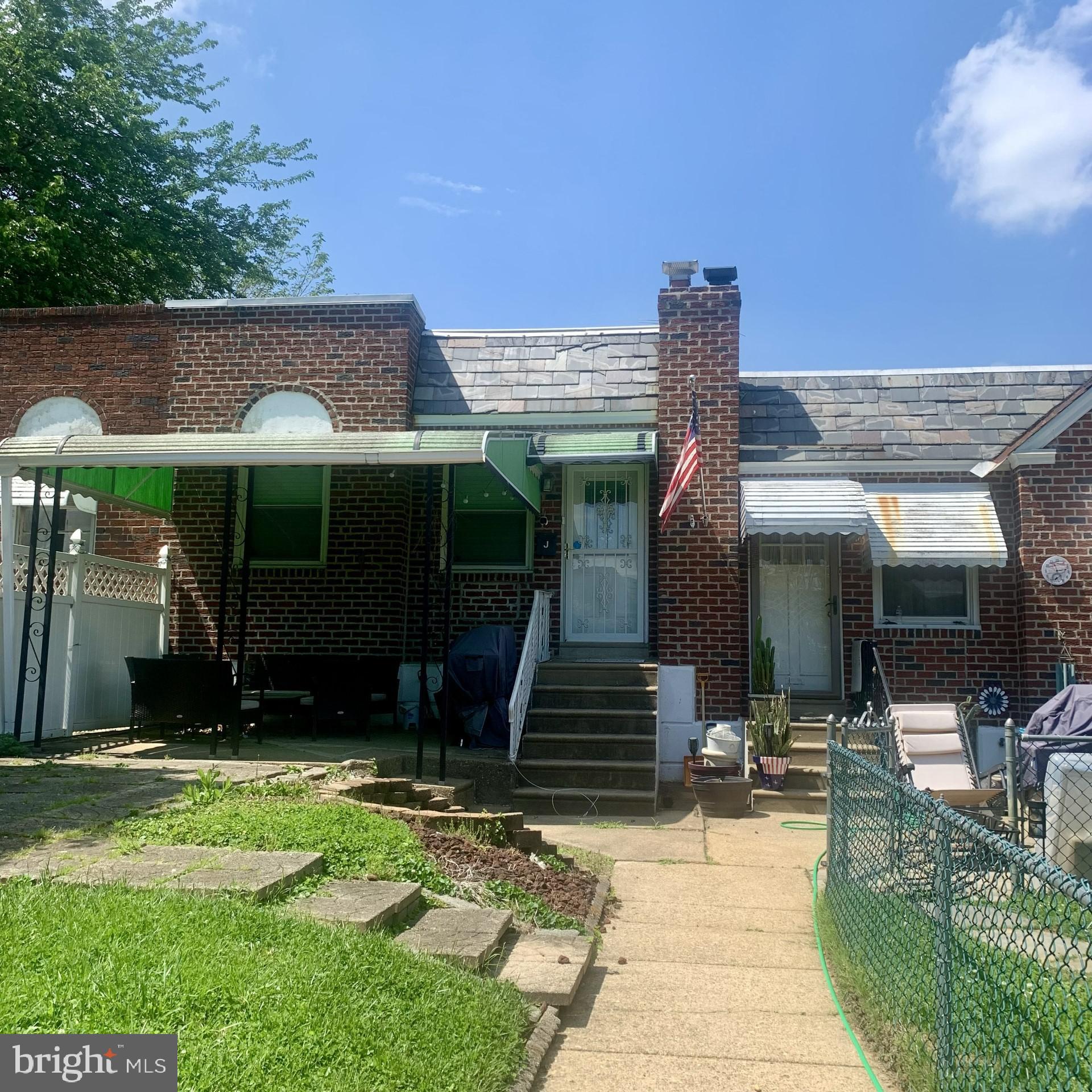 a view of house with yard