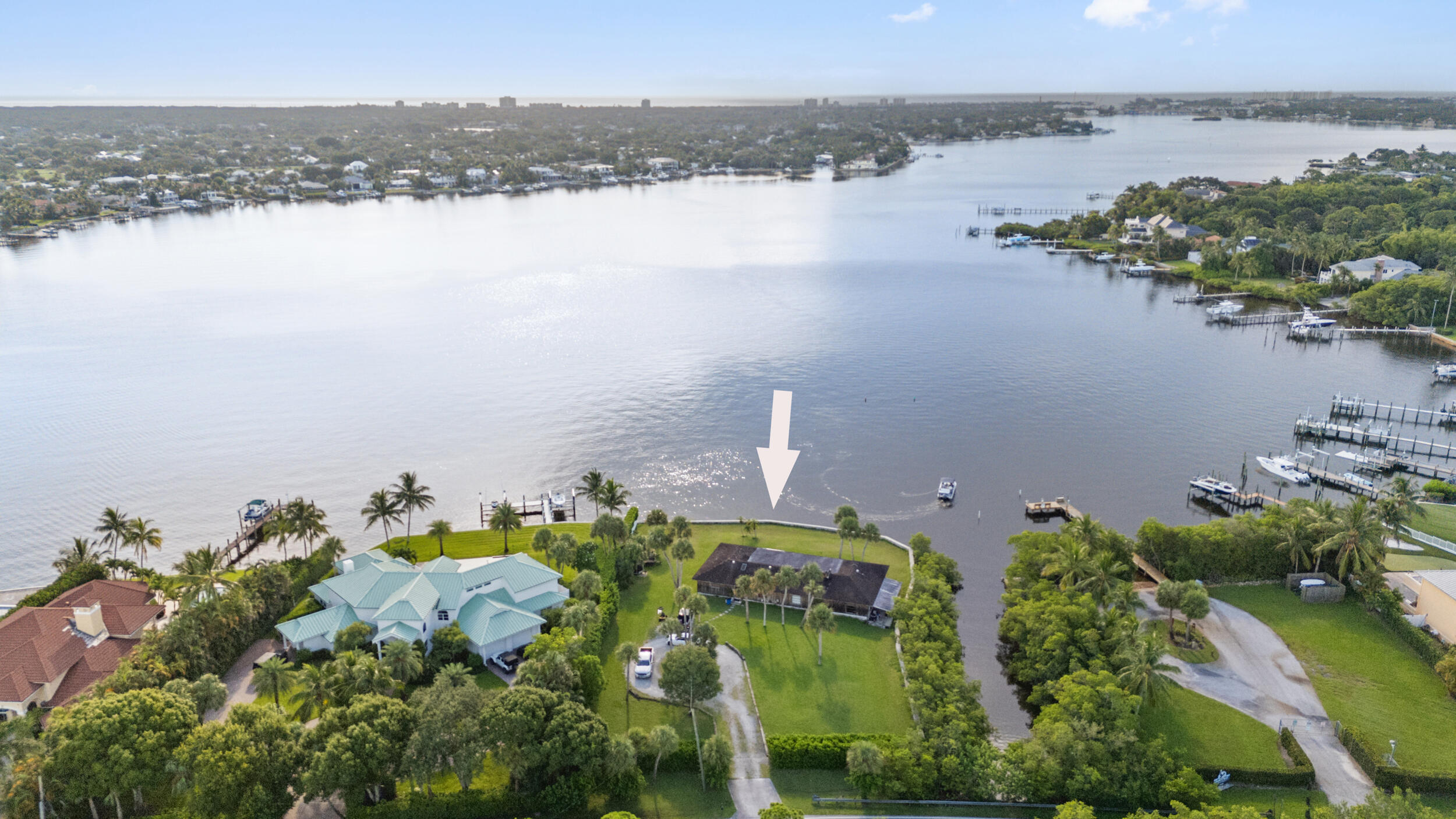 an aerial view of a houses with ocean view