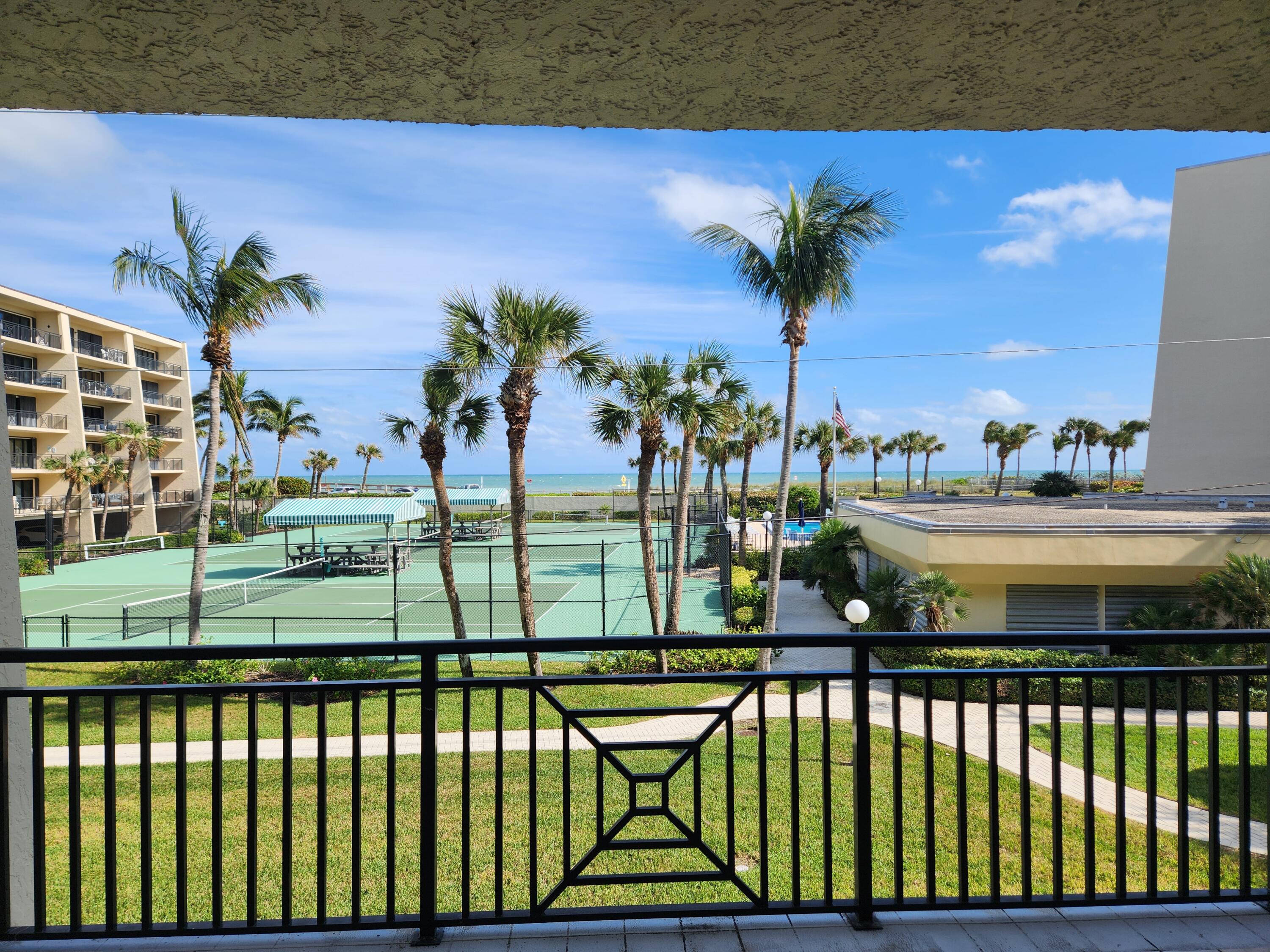 a view of swimming pool from a balcony