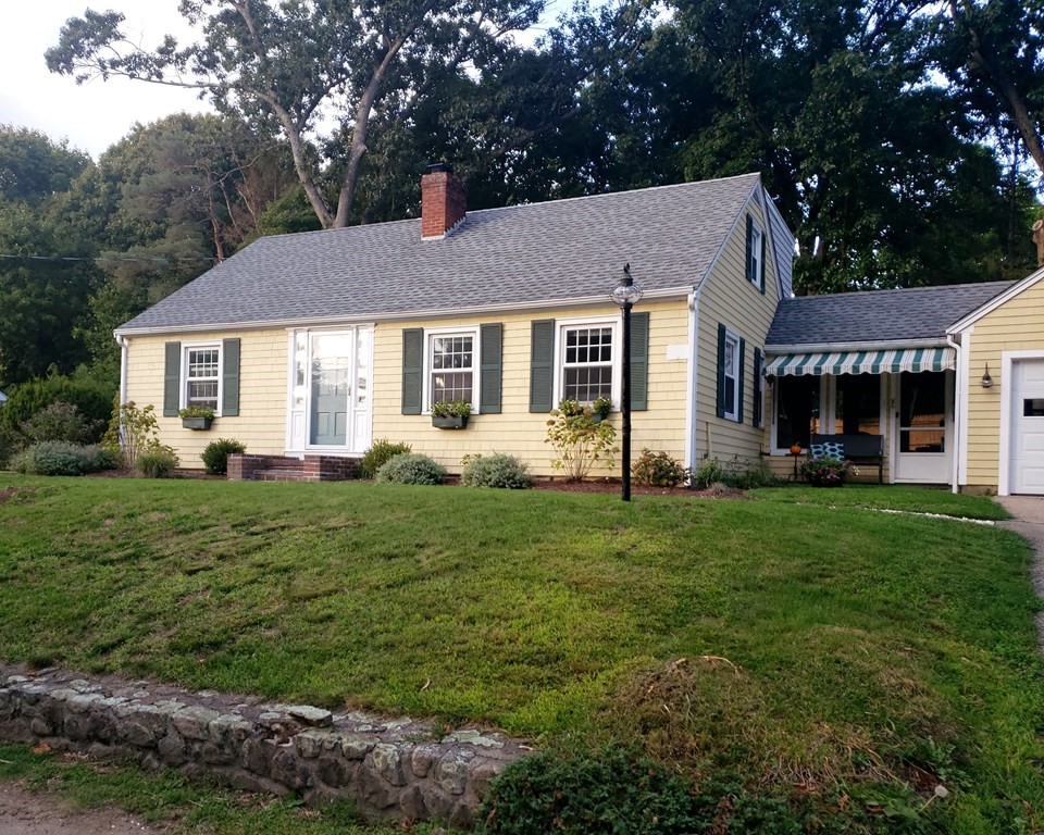 front view of a house with a yard