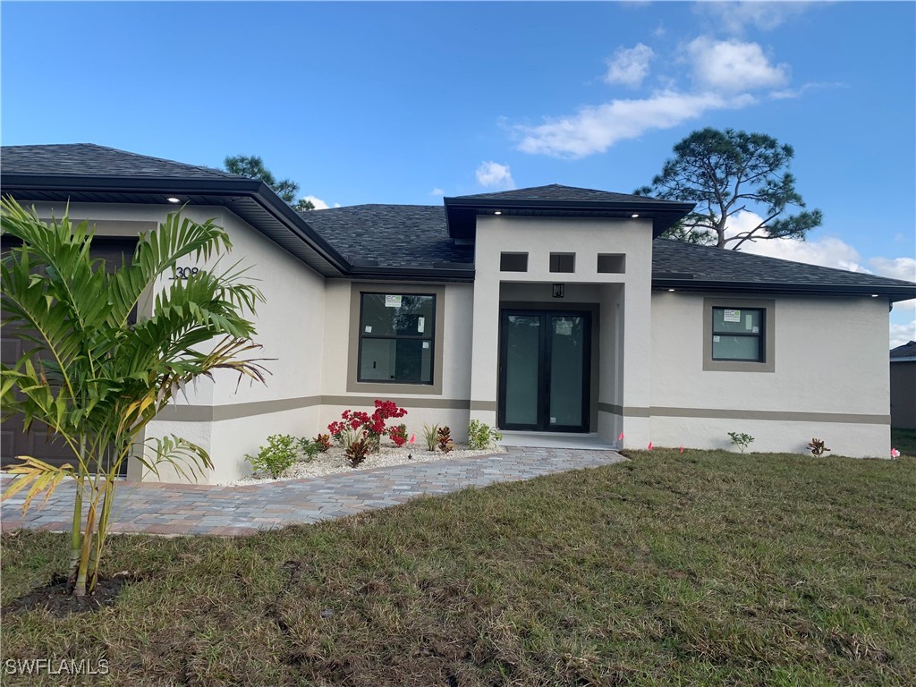 a front view of a house with a yard