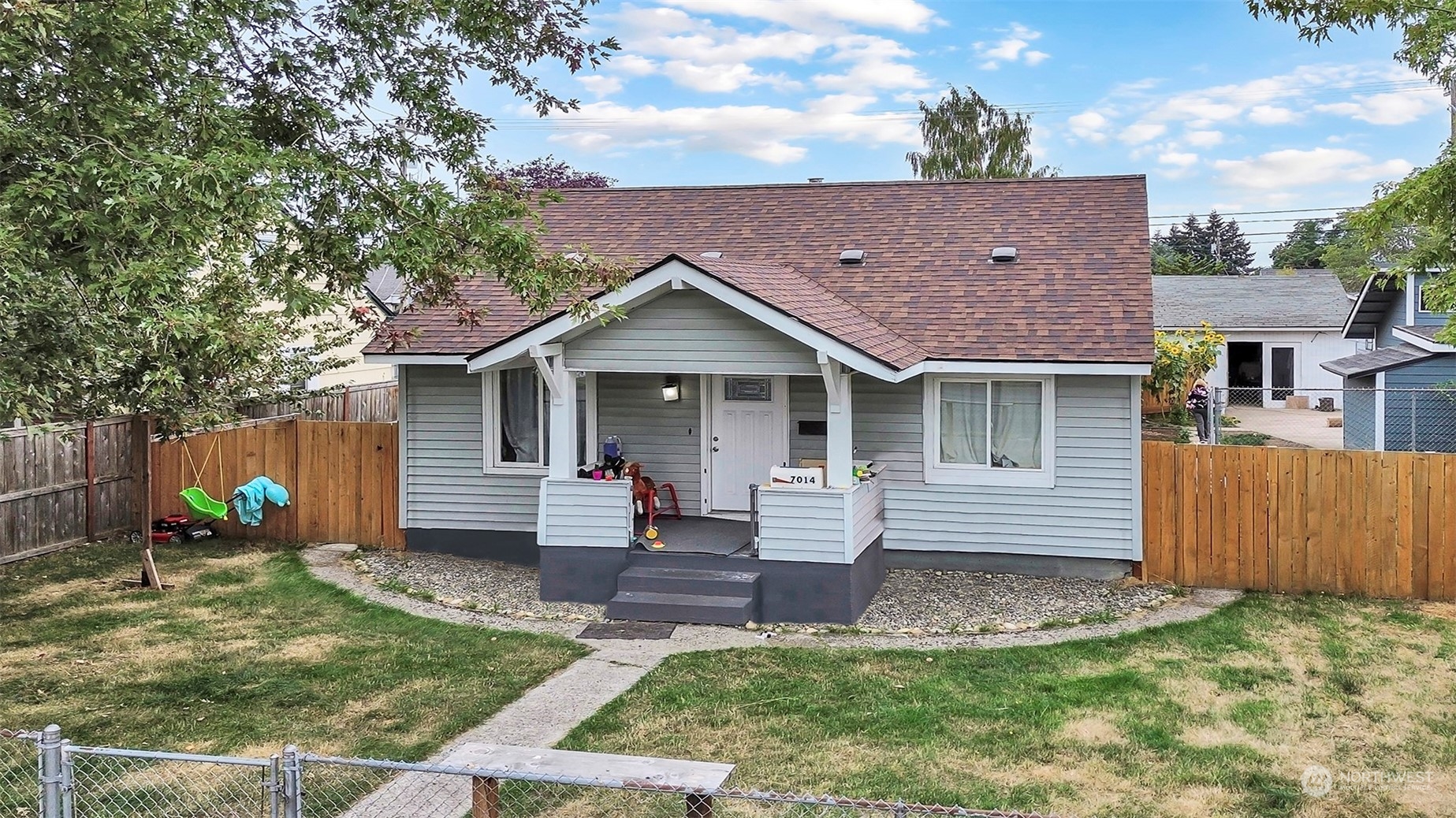 front view of a house with a yard