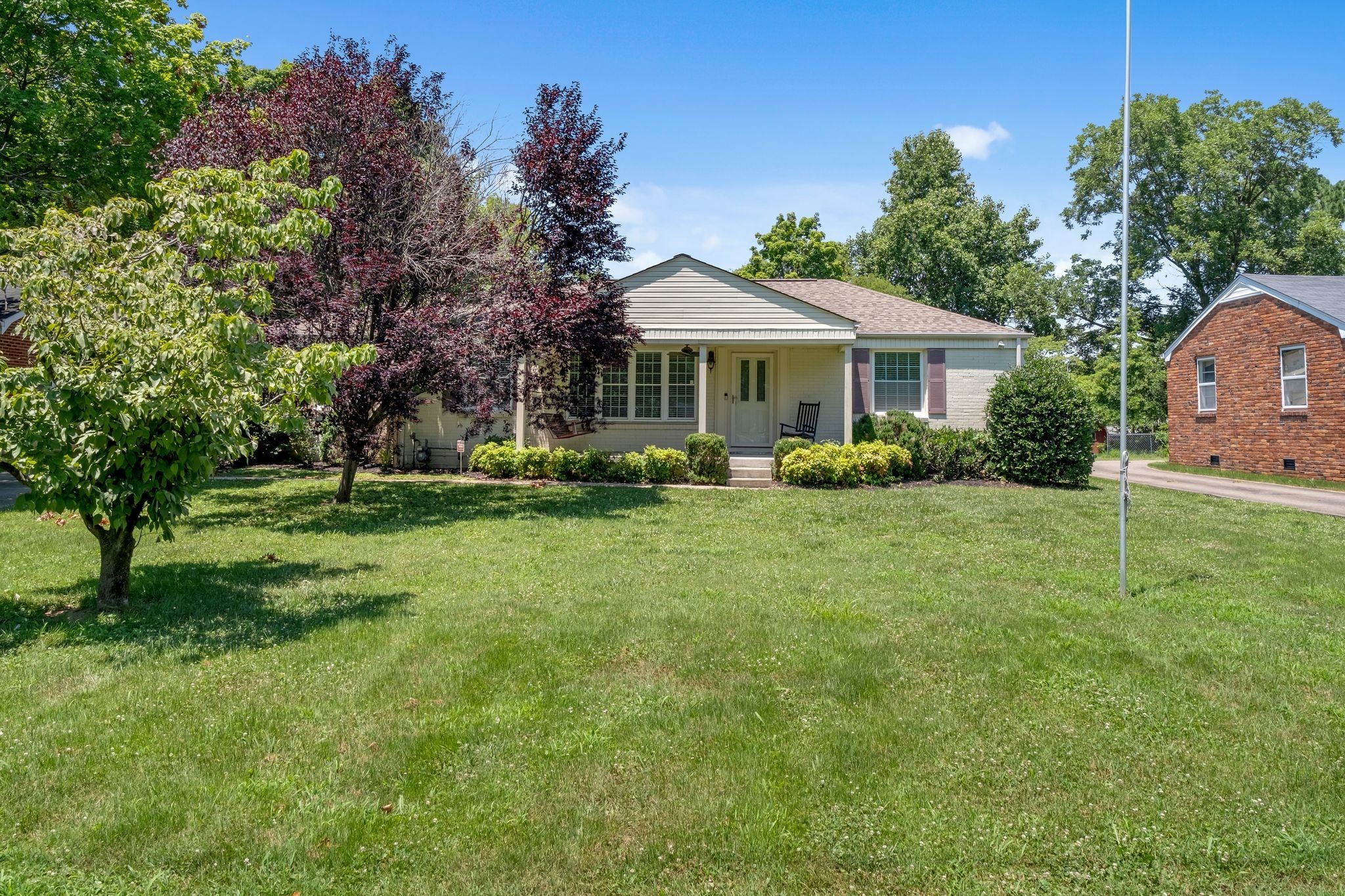 a front view of a house with garden