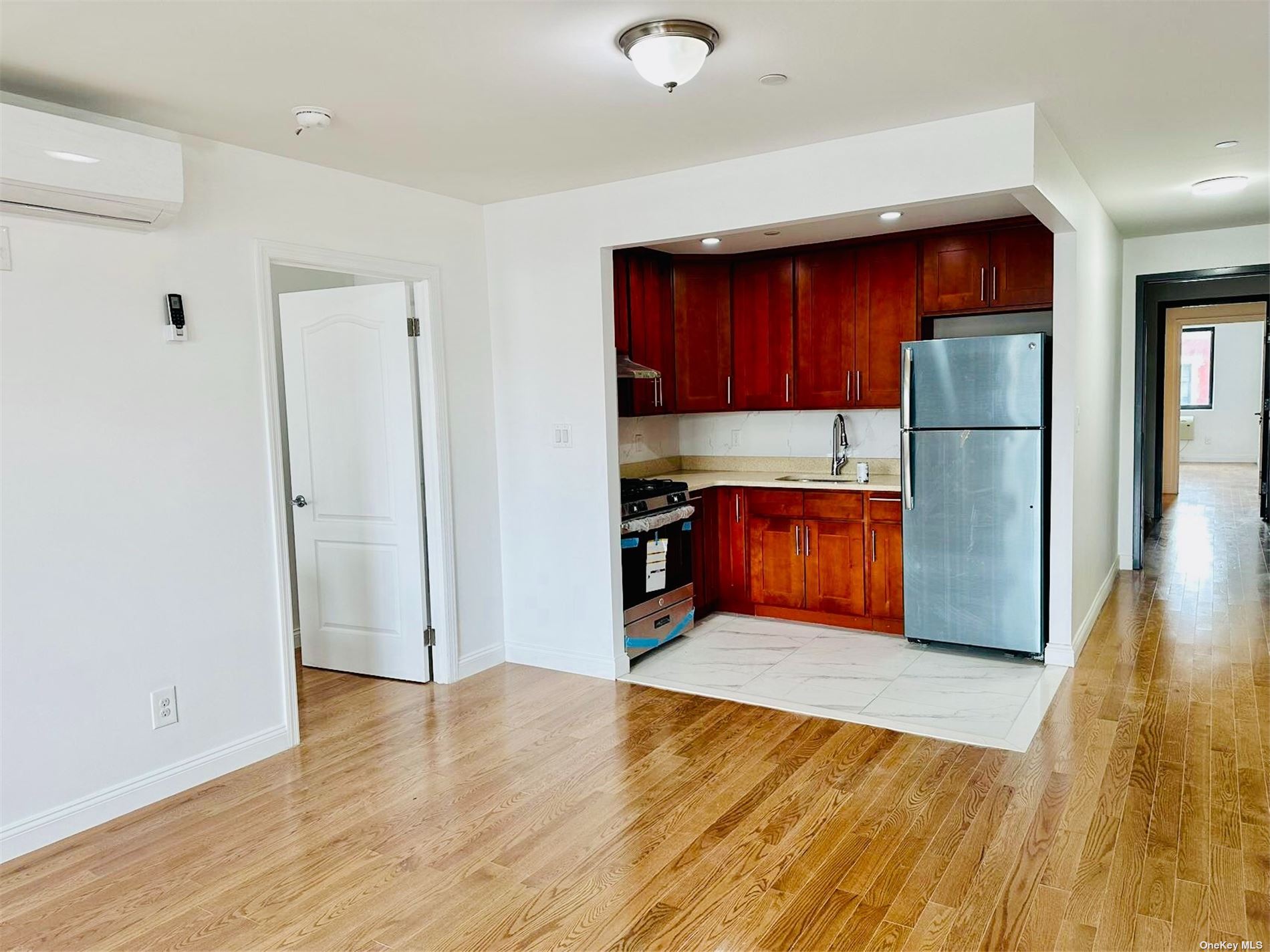 a kitchen with stainless steel appliances granite countertop a refrigerator and a sink