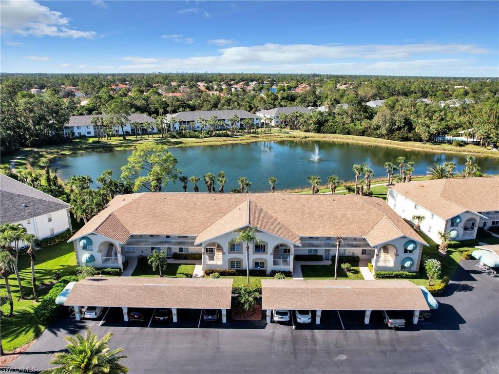 an aerial view of a house with a lake view