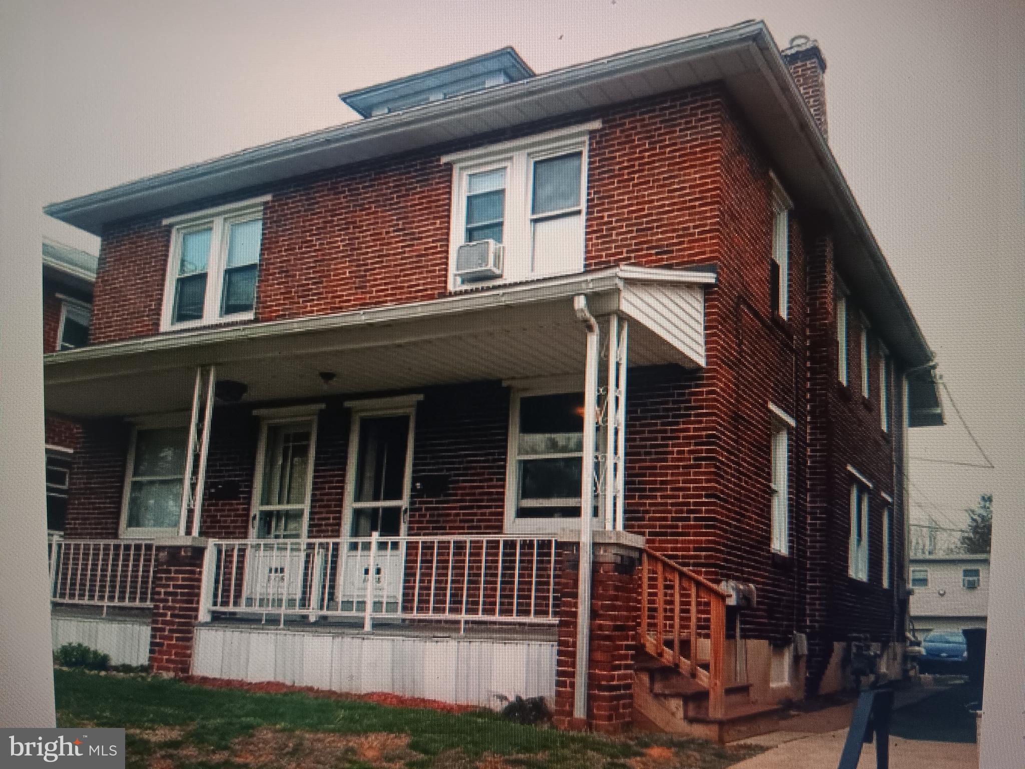 a front view of a house with a porch