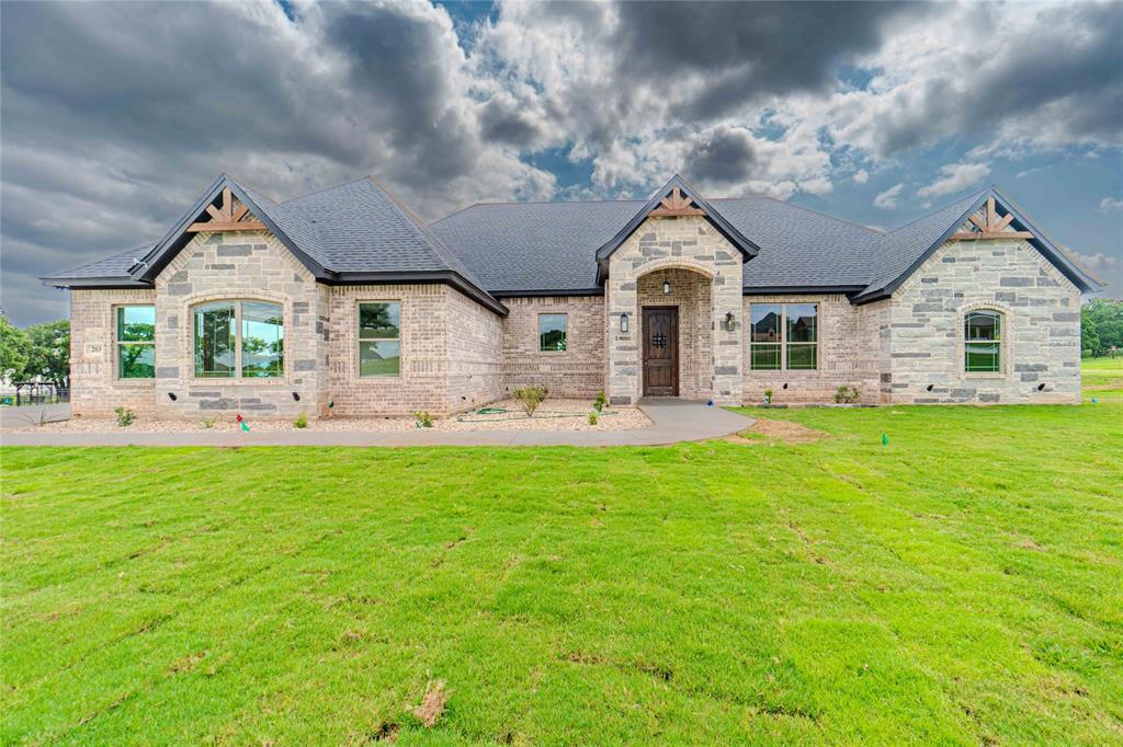 a front view of house with yard and green space