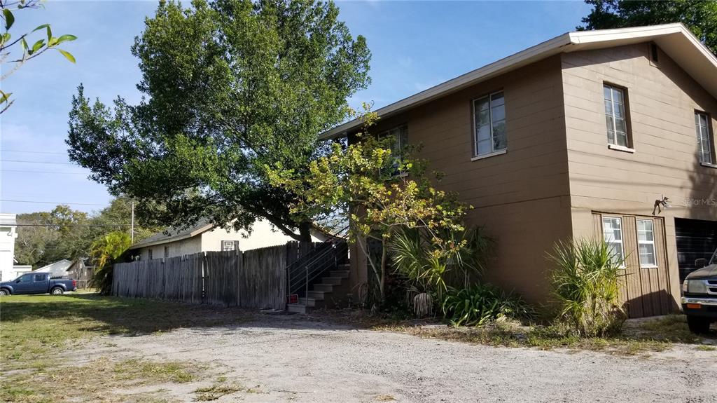 a house with a tree in front of it