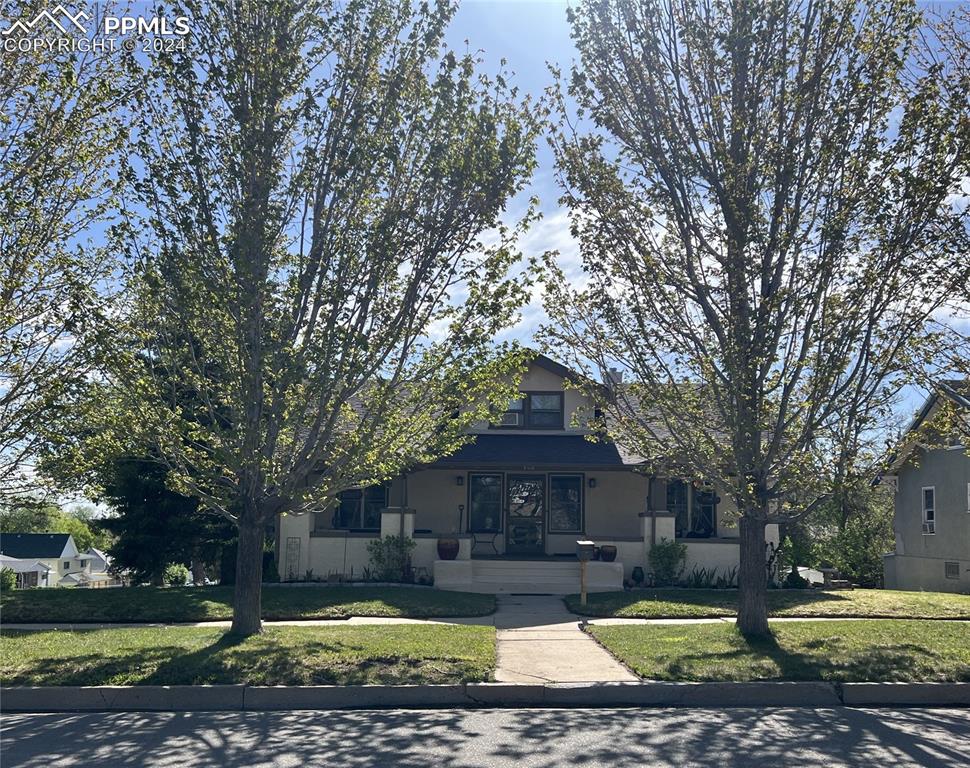 View of front of property with a front yard