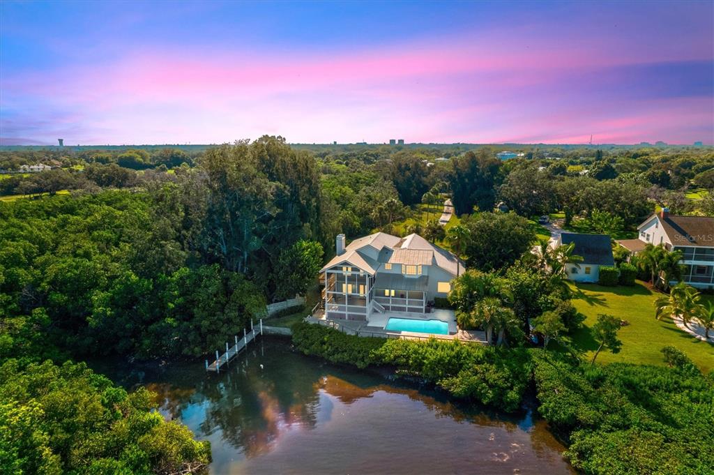 a view of a lake with a house in the background